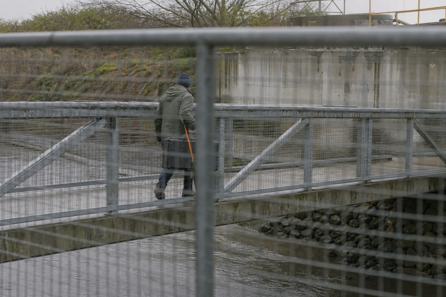 A researcher securing plain sample tins and sleeves in a vehicle case